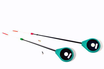 Fitted fishing rods for winter fishing on a white background, close-up
