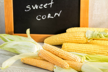 Sweet Corn with black desk as decoration for Thanksgiving Table, Halloween, and the Fall Season
