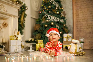 Christmas baby boy with red candy cane