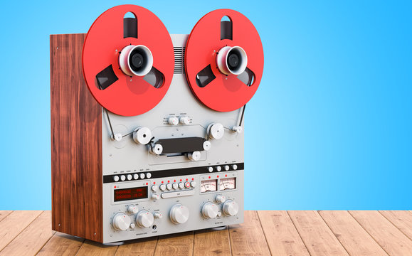 Retro reel-to-reel tape recorder on the wooden table. 3D rendering