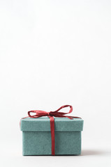 Obraz premium Turquoise Gift Box Tied with Red Raffia Ribbon