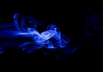 Blue smoke on black background