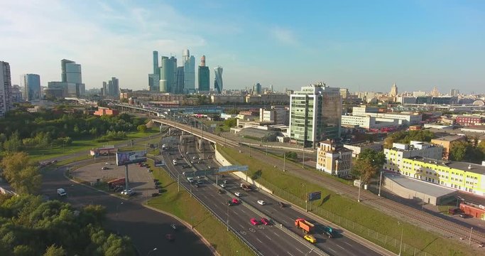 Moscow, Russia. Flight over Moscow - Skyscrapers of Moscow, highway and railway. Aerial flights. UltraHD 4K