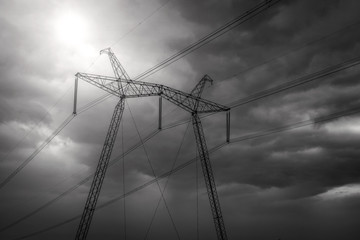  high-voltage  power lines at sunset.