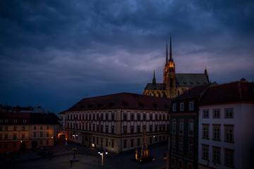 Fototapeta na wymiar The Cathedral of Saints Peter and Paul is located on the Petrov Hill in the center of the city of Brno in the Czech Republic during a dramatic sunset captured from a beautiful view on roo...