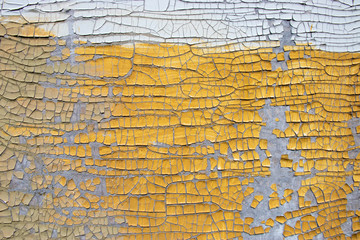 Painted cracked surface colored white and yellow
