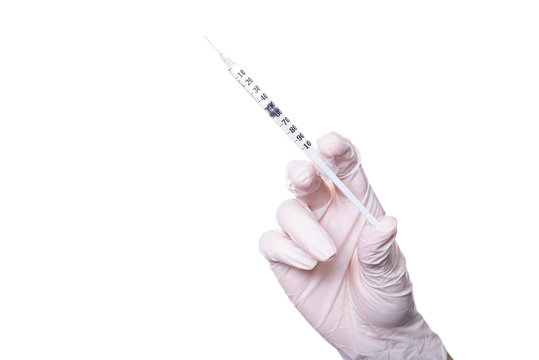 Augmentation rejuvenation skin face transparent adrenalin latex concept. Close up photo of doctor's hand holding thin cosmetic small little syringe with short needle isolated on background