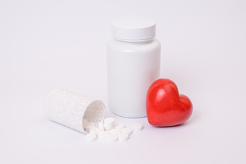 Wellness wellbeing vitality stroke plain clear clinic unhealthy concept. Close up photo of small fall spill tablets on table big with lid red bright heart isolated on sterile background copy-space