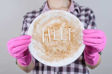 Dish sink worried negative checkered shirt sauce sign sponge people person dish write letters...