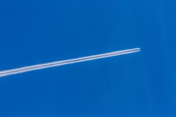 Blue Sky with Airplane Trail