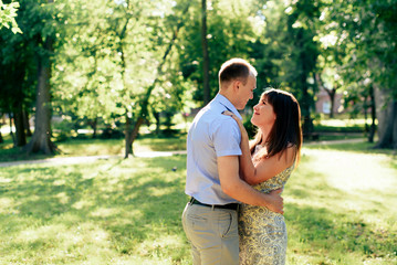 Fototapeta premium young loving couple walking in the park outdoors