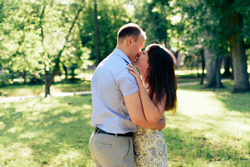 Fototapeta premium young loving couple walking in the park outdoors