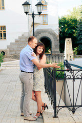 young loving couple walking in the park outdoors