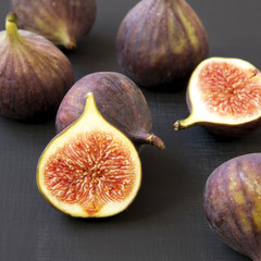 Fresh figs on black background, side view. Close-up.