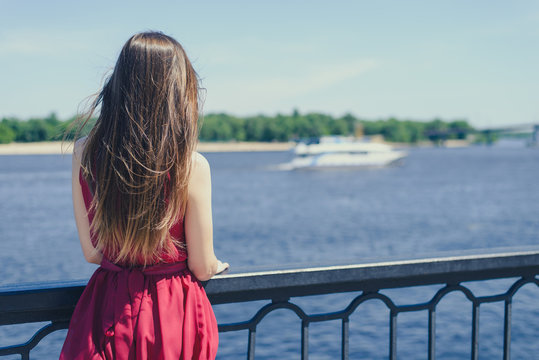 Blue sea sky life sails-man cry day dream sad dreamy lady in red dress concept. Rear back behind view photo portrait of beautiful person looking ship waiting for lover boyfriend enjoying good nature