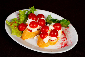 Bruschetta with cheese and tomato