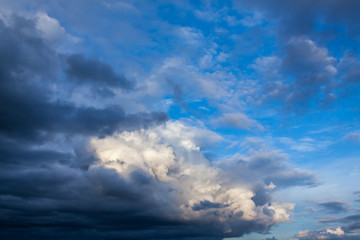 Naklejka na ściany i meble a great storm cloud on a blue autumn sky