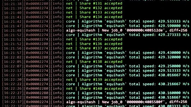 Cryptocurrency mining on a computer screen. The algorithm of the computer program on the monitor. Execution of the program code for the mining program. Pop-up lines of a computer program.