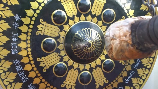 Hitting the oriental gong.