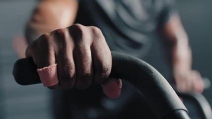 fitness man athlete training using exercise bike intense cardio workout challenge enjoying difficult endurance practice in gym slow motion - Powered by Adobe