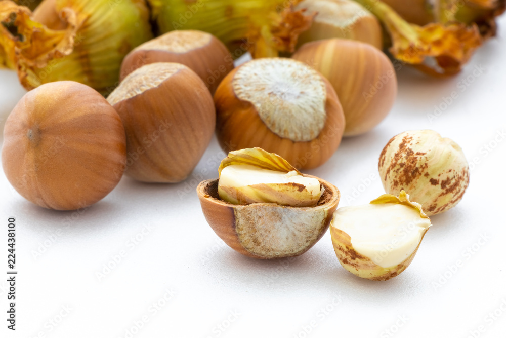 Wall mural Hazelnuts on a white background close-up