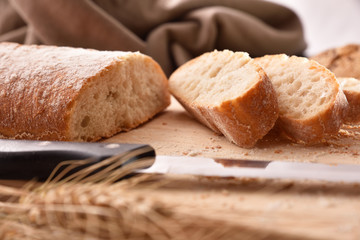 Bread cut into slices on cutting board close up