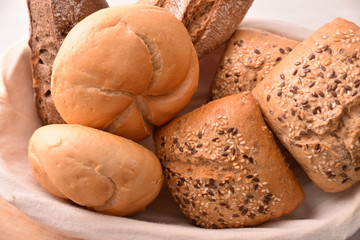 Different types of bread on a bread basket top