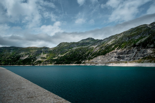 huge dam in the Austrian Maltatal with mountains, river and see around.