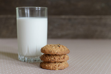 a glass of milk and oatmeal cookies