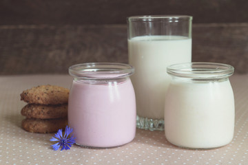dairy products: yogurt, a glass of milk and oatmeal cookies,
rustic style
