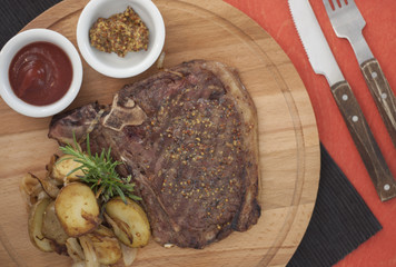 juicy portions of grilled fillet steak on dark background