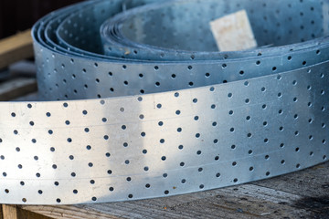 Metal perforated strip for the production of works with wood.