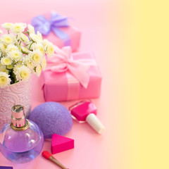 Festive composition with gift box with vase flowers chrysanthemum cosmetics perfume sponge Bright...
