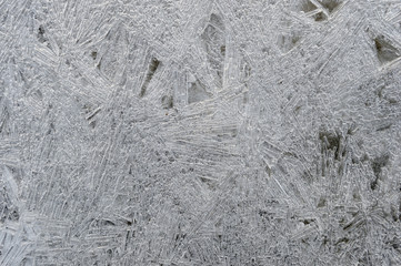 Rime, frost, ice texture. ice pattern texture. Ice on the winter lake. Closeup.