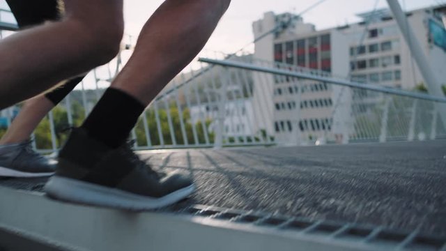 close up athlete legs running up stairs competitive woman runner overtaking jogging fast in urban city race competition