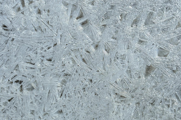 Rime, frost, ice texture. ice pattern texture. Ice on the winter lake. Closeup.