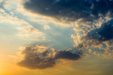 Fototapeta premium Landscape with dramatic light - beautiful golden sunset with saturated sky and clouds.