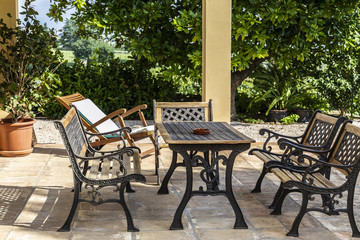 Fototapeta na wymiar Table and chairs in the garden