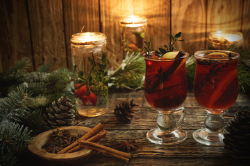 Christmas mulled wine with spices on rustic wooden background