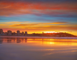 Fototapeta na wymiar Gijon skyline sunset in San Lorenzo beach Asturias