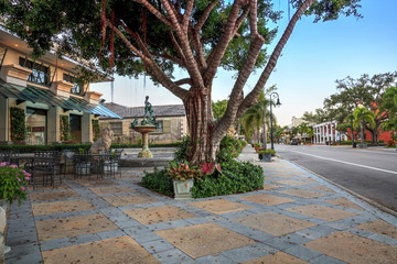 Sunrise over the Third Street shopping district in Old Naples, Florida.