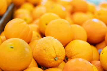 Oranges are fruit that has rich in vitamins and an acid taste. They are displaying on stall to sell to somebody, and looks very fresh.