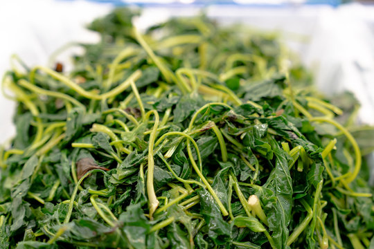 Chwinamul is vegetable that has rich in vitamins and korea tradition food. They are displaying on stall to sell to somebody, and looks very fresh.