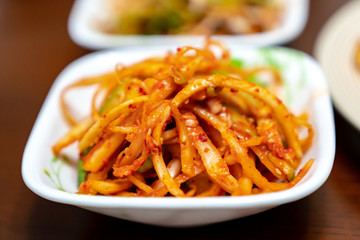 Balloon flower root salad with red chilli is a spicy and salty traditional Korea food. This is a one of famous representative health foods, and this is known to reduce the risk of cancer.