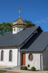 Fototapeta na wymiar Orthodox church with a gilded tower. Church in Central Europe.
