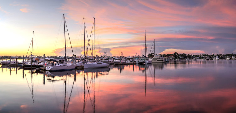 Sunrise over a quiet harbor in old Naples, Florida