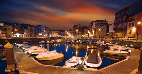 Fototapeta na wymiar Llanes marina port sunset in Asturias Spain