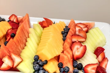 Zelfklevend Fotobehang Fresh fruit platter including watermelon, cantaloupe, honeydew melon © SailingAway