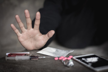  Human hands on dark background, Stop drug addiction concept, Do not interfere with drugs,  International Day against Drug Abuse.