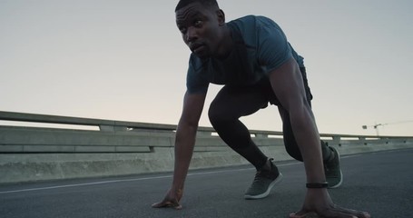 young african american man runner starts running fit male athlete training in urban city at sunrise fitness lifestyle challenge
